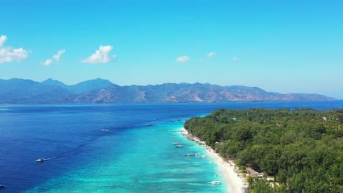 Paradise tropical island with white sandy exotic beach washed by calm clear water of turquoise lagoo