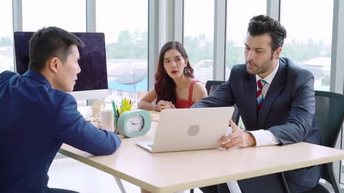 Colleagues Meeting Discussing Business in Bright Office