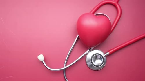 Heart and Stethoscope on a Red Background