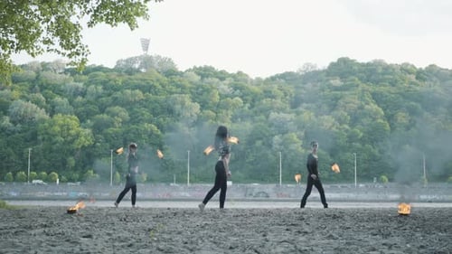 Skilled Fire Spinners Perform in Urban Setting