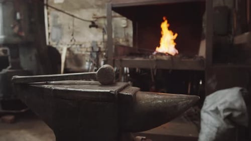 Hammer on Anvil in Blacksmith Workshop