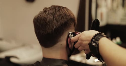 Haircut with Hair Trimmer in a Barber Shop