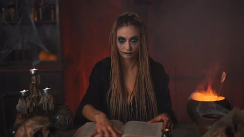 Young Adult with Make-up Reading by Cauldron Fire
