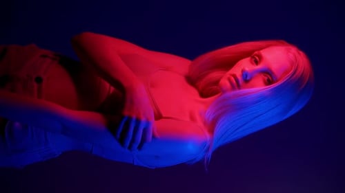 Woman Posing with Red and Blue Lights