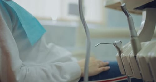 Woman in Dental Chair With Medical Professional