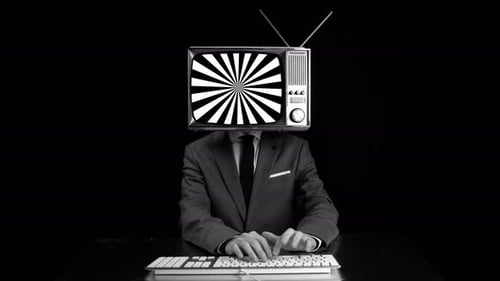 Man with TV Head Typing at Desk