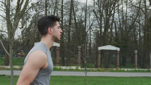 Young Adult Man Jogging in the Park