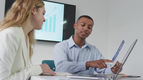 Man and woman discussing at the office