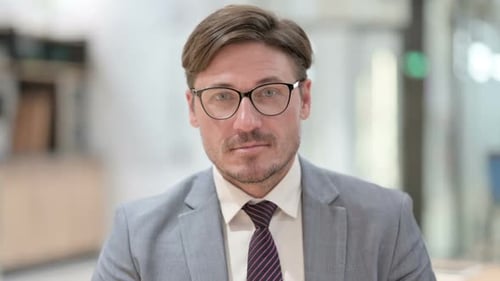 Focused Man in Suit in Office Close Up