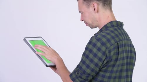 Profile View of Hipster Man Using Digital Tablet