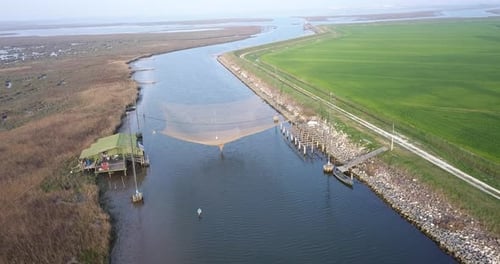 Aerial View of a Fishing Net Above the River