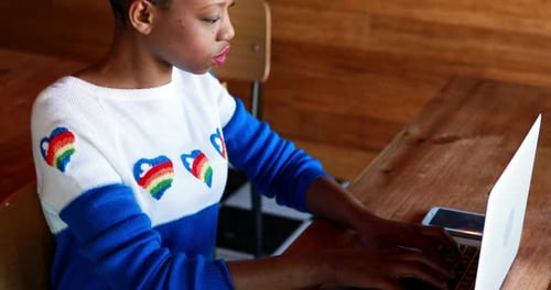 Woman Uses Laptop and Answers Phone