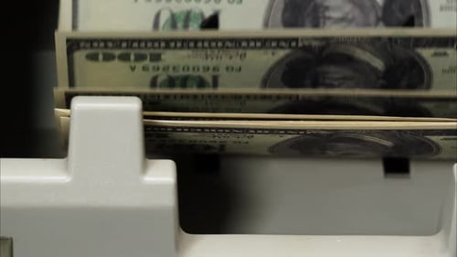 Money Counting Machine Rapidly Counts Currency