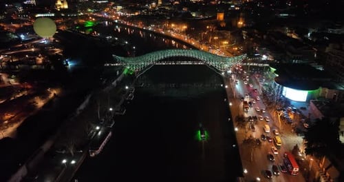 Aerial view of Tbilisi city central park and Bridge of Peace. Beautiful cityscape of old Tbilisi