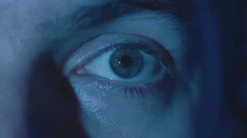 Closeup Reflection in the Eye of Light From the Screen