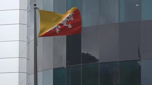 Waving Bhutan Flag Against Modern Building
