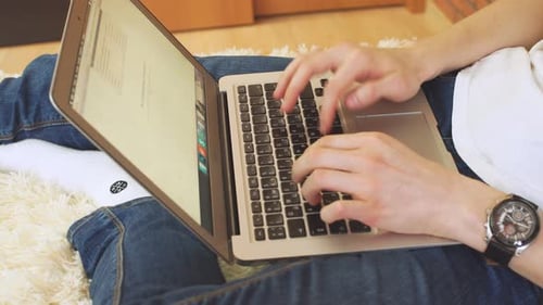 Successful Businessman Using Laptop at Home Living Room Home Office.