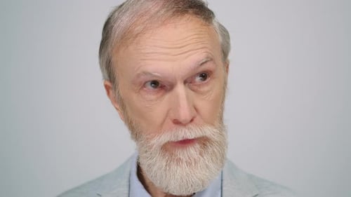 Serious Man Posing to Camera in Studio