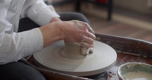 Ceramist Sculpts on a Potter's Wheel Video From Pottery Workshop Potter Makes Ceramics in Slow