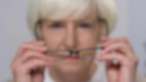 Elderly Lady Wearing Eye Glasses Cheerfully Smiling at Camera, Vision Care
