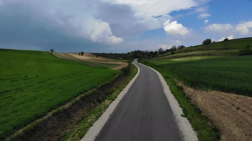 Scenic Country Road Through Farmland Aerial View