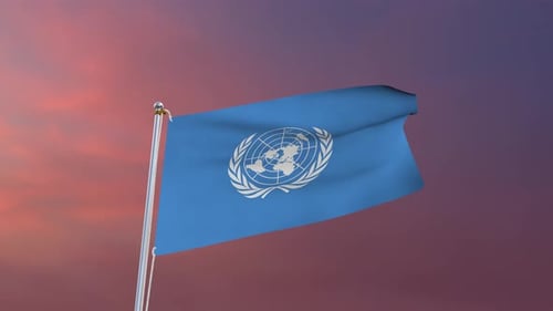 United Nations Flag Waving Against Sunset Sky