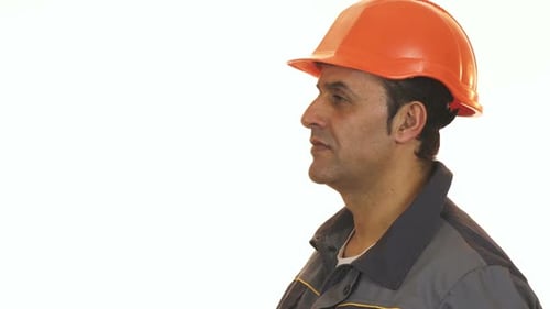 Construction Worker Holding Drill Tool in Studio