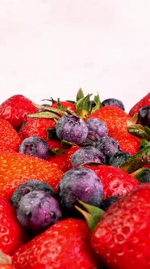 Close Up of Strawberries and Blueberries with Water