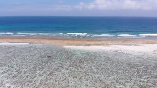 Ocean Coastline and Barrier Reef at Low Tide Zanzibar Matemwe Aerial View