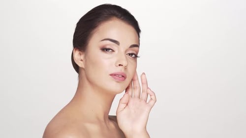 Studio portrait of young and beautiful brunette woman over