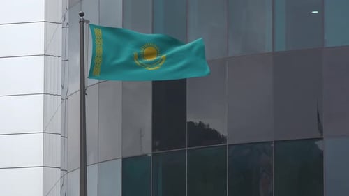 Kazakhstan Flag Waving on Modern Corporate Building
