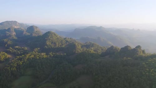 Aerial top view of forest trees and green mountain hills. Nature landscape background, Thailand.