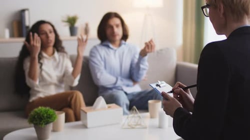 Couple Discussing Problems with Therapist During Therapy Session