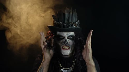 Man With Skeleton Makeup Screams in Dim Lighting