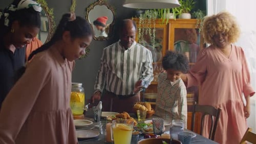 Family Gathered Around Table for Meal