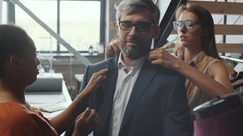 Businessman Trying on Custom Suit in tailoring Studio