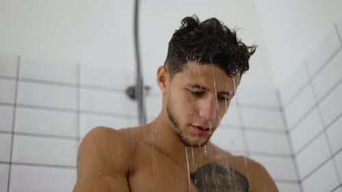Handsome Young Man Taking a Shower