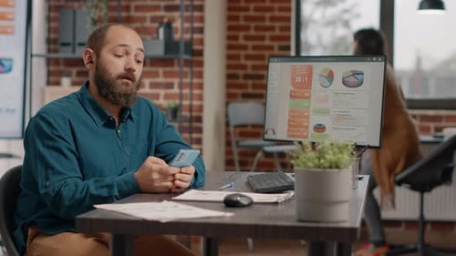 Entrepreneur Using Smartphone to Work on Business Project