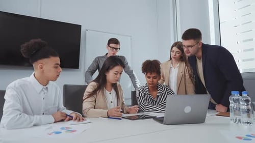 Young Professionals Collaborating at an Office Conference Table