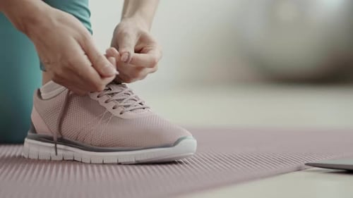 Shoe Laces Tied Before Workout on Exercise Mat