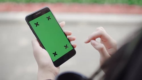Female Hand Holding Touchscreen Device