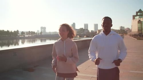 Jogging Together Near River