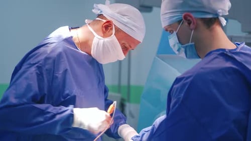 Surgeons Performing Operation in Hospital Operating Room
