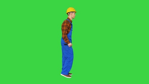 Funky Dancing By Young Construction Worker in Safety Hat on a Green Screen, Chroma Key