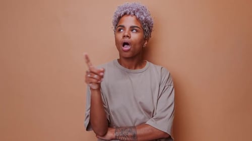 Thoughtful Woman with Curly Hair Having an Idea