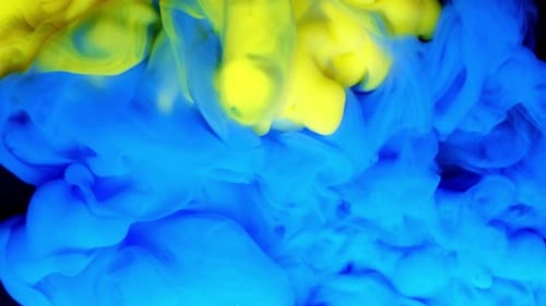 Abstract Blue and Yellow Ink Swirling Together