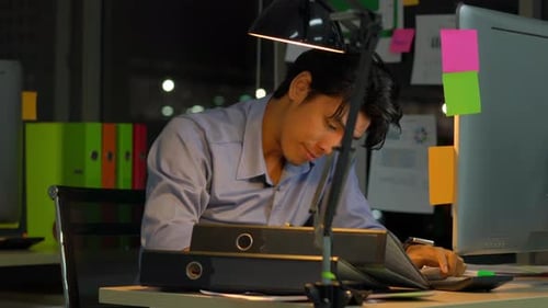 Businessman hard working to late night at office