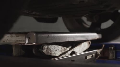 Car Is Lifting on the Vehicle Service Stand, Car Repair Service, Wheel Alignment