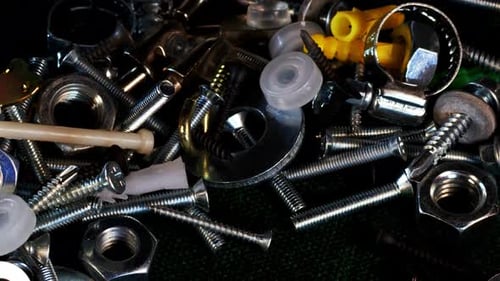 Shiny Metallic Fasteners Piled Close Up