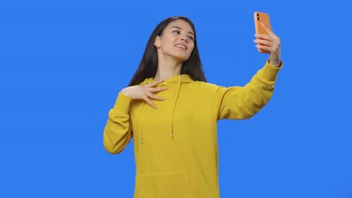 Young Woman Video Chatting on Mobile Phone